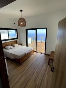 Postel nebo postele na pokoji v ubytování Villa Ti Rati - Vue mer exceptionnelle sur Saint Leu