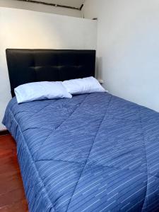 Letto o letti in una camera di Rustic House in the Heart of Cusco