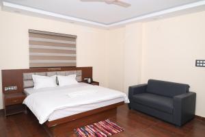 Hotel Siddhi Residency客房内的一张或多张床位