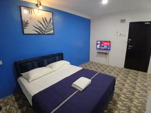 Postel nebo postele na pokoji v ubytování BOSS Hotel