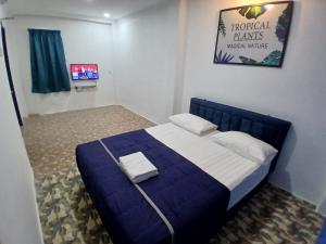 Postel nebo postele na pokoji v ubytování BOSS Hotel