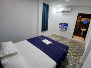 Postel nebo postele na pokoji v ubytování BOSS Hotel
