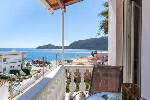 a balcony with a view of the ocean at Theklas Studios Sea View in Agios Georgios Pagon