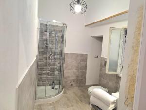 a bathroom with a shower and a toilet at Nata Sicula 3 in Siracusa +21 photos