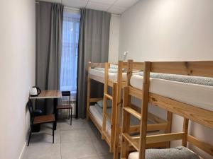 Postel nebo postele na pokoji v ubytování Golden Hostel