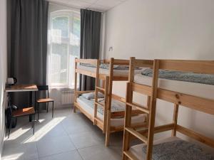 Postel nebo postele na pokoji v ubytování Golden Hostel