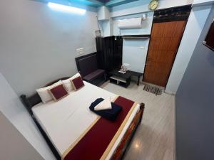 Postel nebo postele na pokoji v ubytování PANMOZHI RESIDENCY