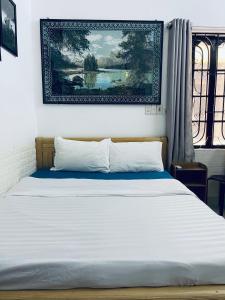Postel nebo postele na pokoji v ubytování Friendly House Homestay