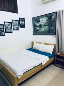 Postel nebo postele na pokoji v ubytování Friendly House Homestay