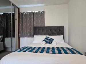 Ένα ή περισσότερα κρεβάτια σε δωμάτιο στο Double Room in a shared 4 bedroom family home in Broomfield