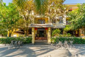 a group of bikes parked in front of a building at Ahoy Hoi An Boutique Resort & Spa in Hoi An