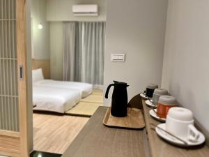 Postel nebo postele na pokoji v ubytování 不想上班 宜蘭民宿-Don't Wanna Work B&B