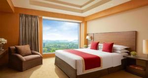 Voodi või voodid majutusasutuse Hotel Olive Aero Suites Near Delhi Airport toas