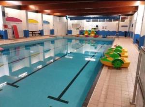 a large swimming pool in a large room at The Dean's on the Edge in Heysham