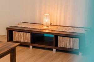 a table with a vase on top of it at Maroochydore Coastal Suite in Maroochydore