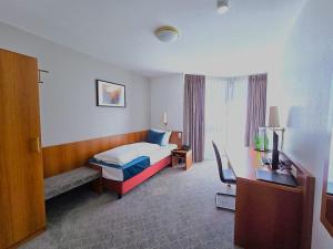 Ein Bett oder Betten in einem Zimmer der Unterkunft Concorde Hotel Ascot