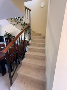 a staircase leading up to a dining room at Alojamiento Vista Hermosa in Ayamonte +16 photos