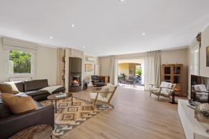 a living room with a couch and a table at Villa Lavyn in Grimaud