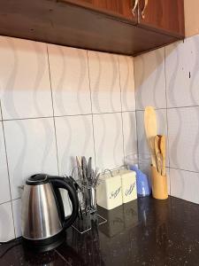 Η κουζίνα ή μικρή κουζίνα στο Flo Mcc +2 φωτογραφίες