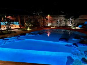 a hot tub in a yard at night at Turquoise Villa in Floridablanca