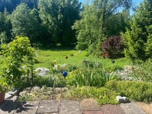a garden with flowers and plants in a field at 2 Personen Appartement Sonnental in Greiling