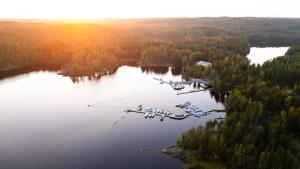 an airplane is flying over a body of water at Sahanlahti Resort in Puumala