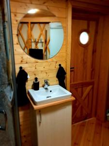 a bathroom with a sink and a mirror at 4 Żywioły -całoroczne jurty w Sudetach in Stronie Śląskie +74 photos