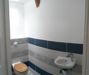 a bathroom with a toilet and a sink at B&B Bio et écolo du Besset in Yssingeaux