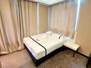 Postel nebo postele na pokoji v ubytování Seeds Hotel Kuala Selangor