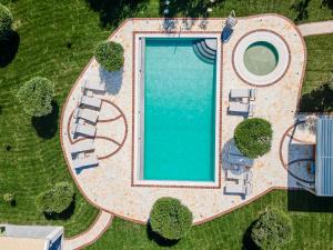 an overhead view of a swimming pool in a yard at Villa Arthur in Kassiopi +92 photos