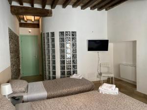 A bed or beds in a room at Civico 18 B&B