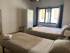 A bed or beds in a room at Civico 18 B&B