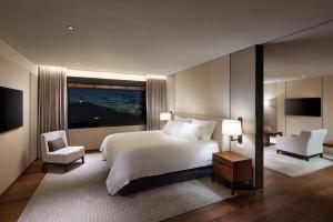 a bedroom with a white bed and a large window at The Shilla Seoul in Seoul