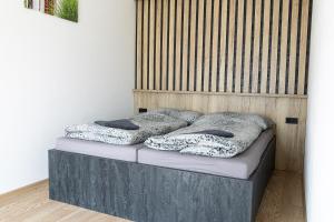 two pillows on a bed in a room at San Marco - Na Brněnské ulici in Mutěnice +30 photos