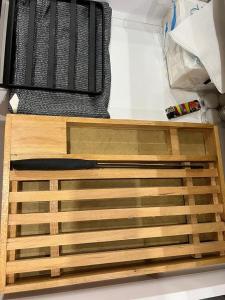 a wooden drawer in a refrigerator with a knife at Luxury 2 bedrooms apartment in kantaoui in Bin Rhilouf
