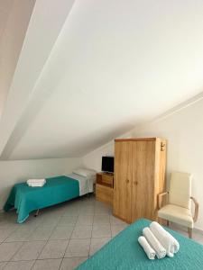 Postel nebo postele na pokoji v ubytování Hotel Ginevra e Residence