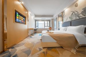 Televizors / izklaižu centrs naktsmītnē Kuanyue Service Apartment Chongqing Lijia Children's Hospital Happy Valley Branch