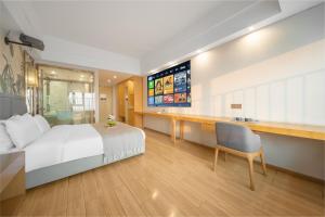 Gulta vai gultas numurā naktsmītnē Kuanyue Service Apartment Chongqing Lijia Children's Hospital Happy Valley Branch