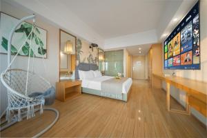 Gulta vai gultas numurā naktsmītnē Kuanyue Service Apartment Chongqing Lijia Children's Hospital Happy Valley Branch
