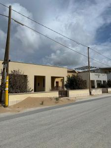 a building on the side of a street at Casa Margherita in Tre Fontane