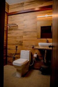 a bathroom with a toilet and a sink at Casa Aqua Mandrem in Mandrem +25 photos