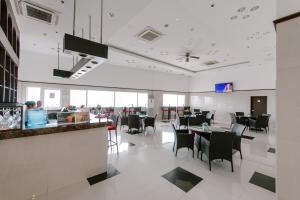 a dining room with tables and chairs in a restaurant at Toyoko Inn Cebu in Cebu City