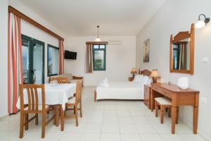 A television and/or entertainment centre at Roubini Apartments