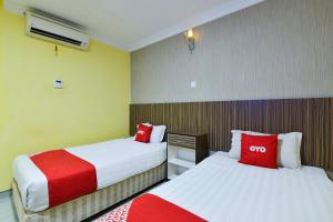 Postel nebo postele na pokoji v ubytování Hotel O Rayyan Soffea Managed by Oravel
