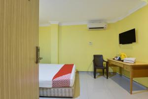 TV a/nebo společenská místnost v ubytování Hotel O Rayyan Soffea Managed by Oravel