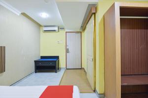 Postel nebo postele na pokoji v ubytování Hotel O Rayyan Soffea Managed by Oravel