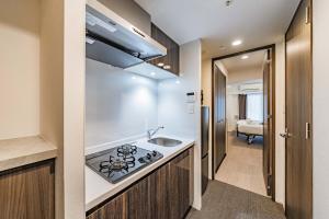 Kuchnia lub aneks kuchenny w obiekcie Apartment Hotel 11 Nagoya