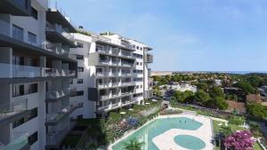 an aerial view of a building with a swimming pool at Casa Catalina - breathtaking sea views by OYOOSTAYS in Dehesa de Campoamor