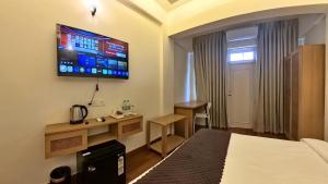 Postel nebo postele na pokoji v ubytování Maashpi Hotel & Resort, Candolim