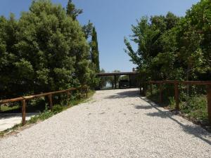 a driveway with a wooden fence and a bridge at Scappo in Umbria, Casale Lenuccia in Collelungo +41 photos